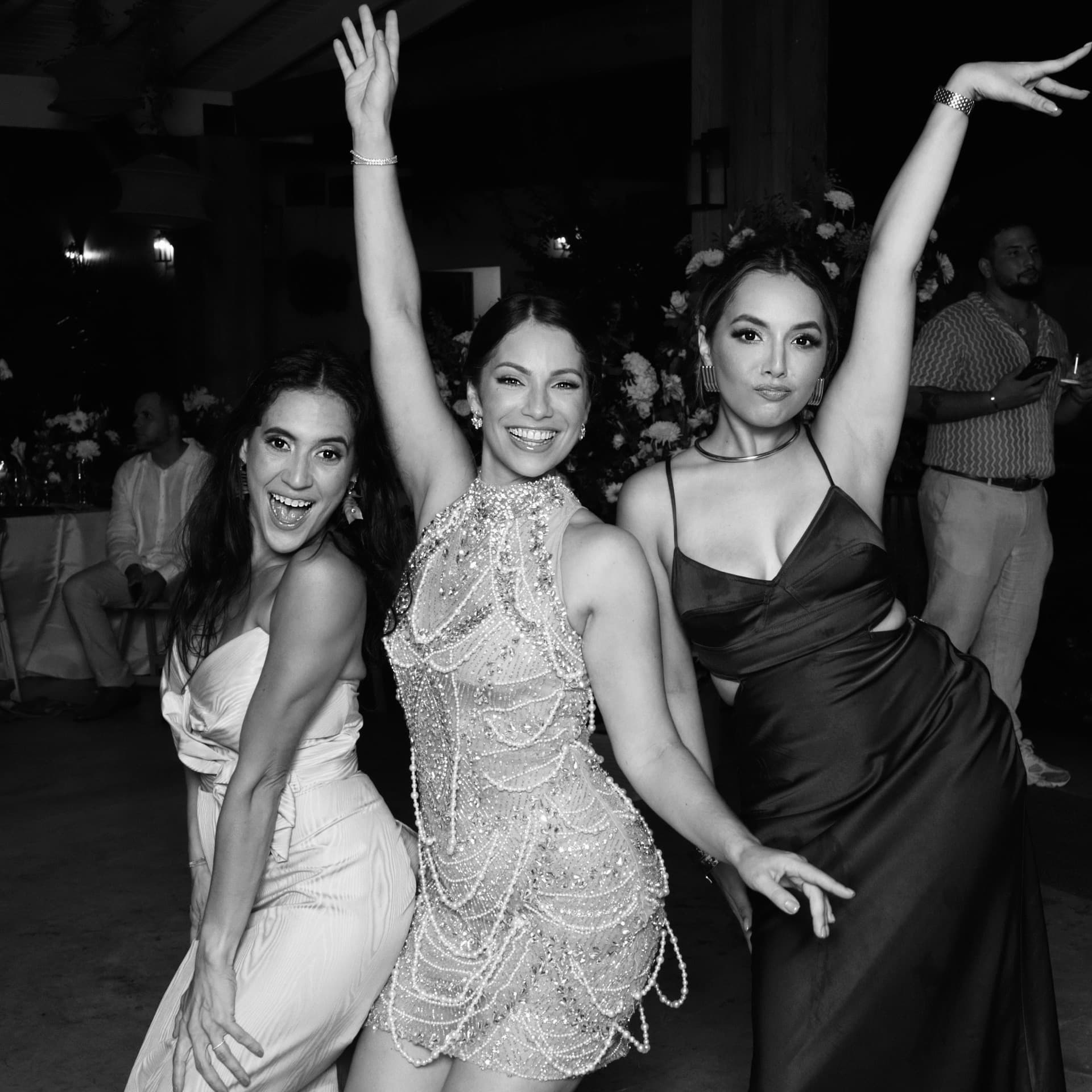 Guests posing and laughing at the Luxpiq photo booth during a wedding reception
